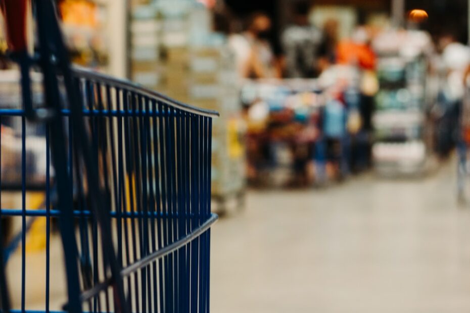 blue shopping cart on street during daytime