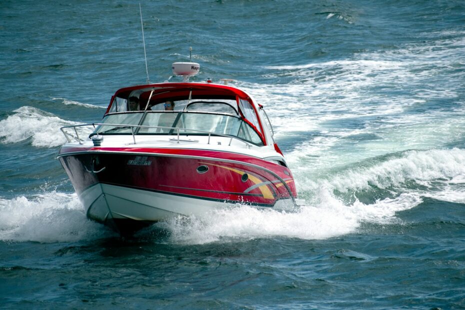 white and red boat on sea during daytime